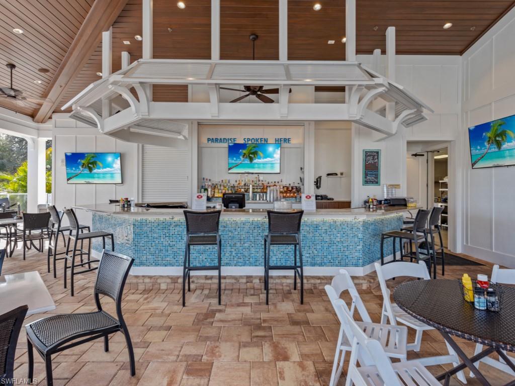 770 Eagle Creek Drive, Unit 301 Naples, FL 34113 - Photo 44 of 46 a view of a dining area with furniture