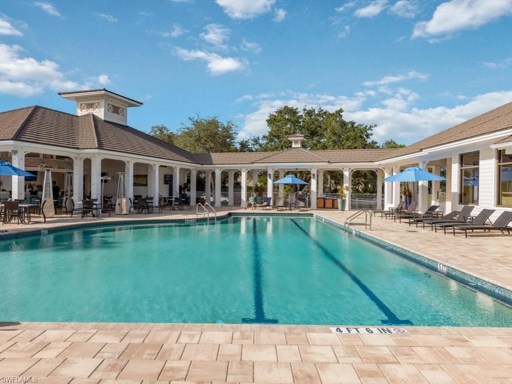 770 Eagle Creek Drive, Unit 301 Naples, FL 34113 - Photo 45 of 46 a view of a house with a swimming pool