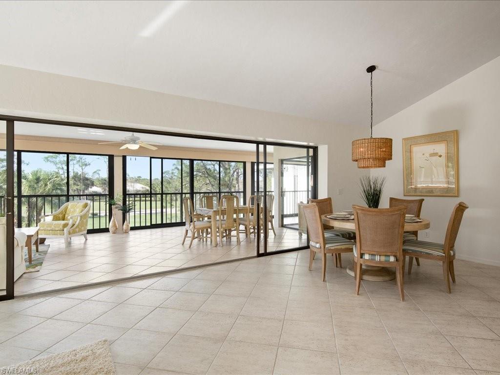 770 Eagle Creek Drive, Unit 301 Naples, FL 34113 - Photo 8 of 46 a dining room with furniture and window