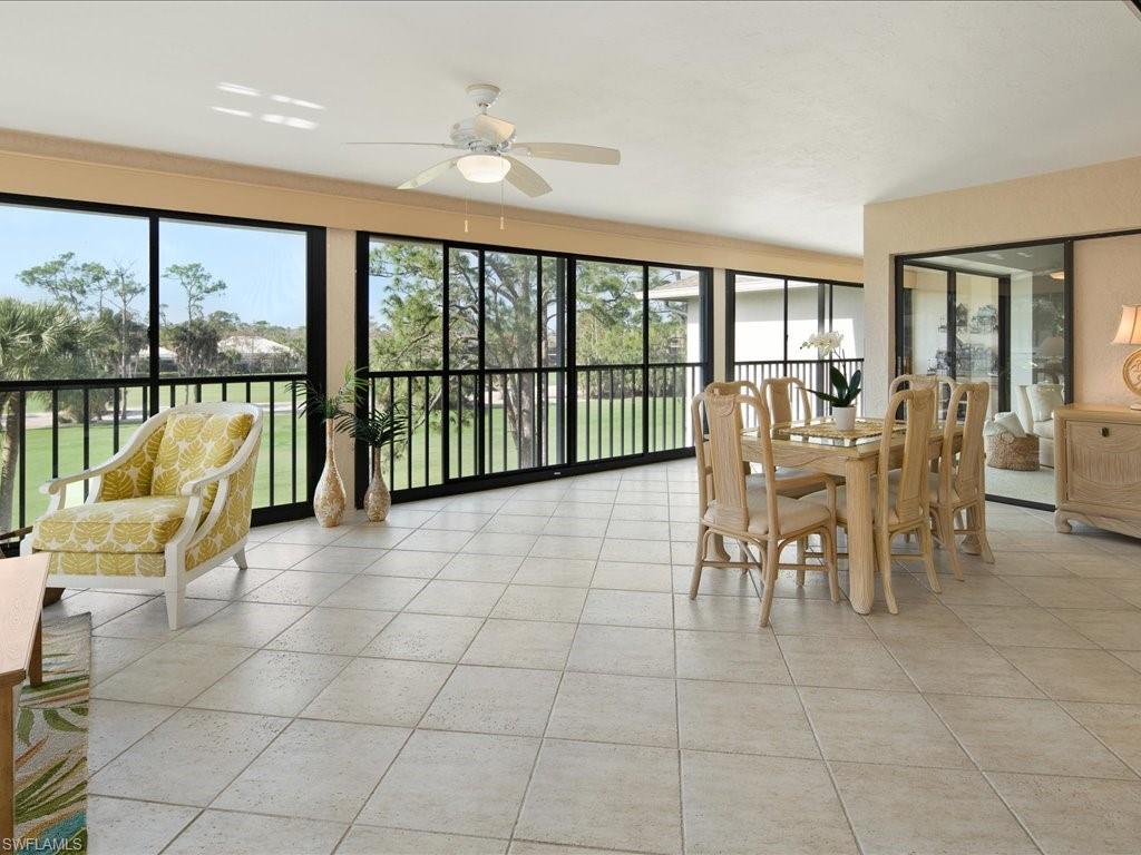 770 Eagle Creek Drive, Unit 301 Naples, FL 34113 - Photo 9 of 46 a dining room with furniture and large windows