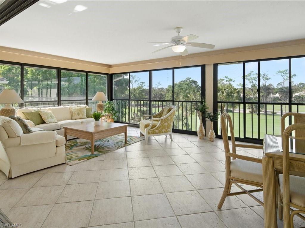 770 Eagle Creek Drive, Unit 301 Naples, FL 34113 - Photo 10 of 46 a living room with furniture and a large window