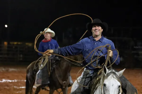a view of a swimming pool with an outdoor space and seating area