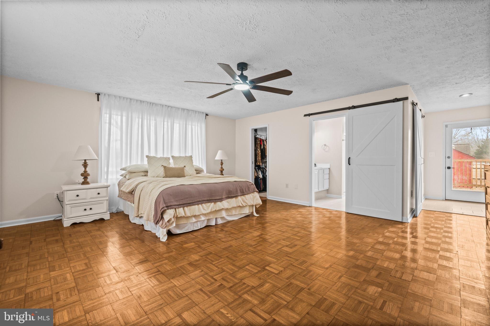 10514 Willetts Crossing Road White Plains, MD 20695 - Photo 13 of 41 a bedroom with a bed and a ceiling fan