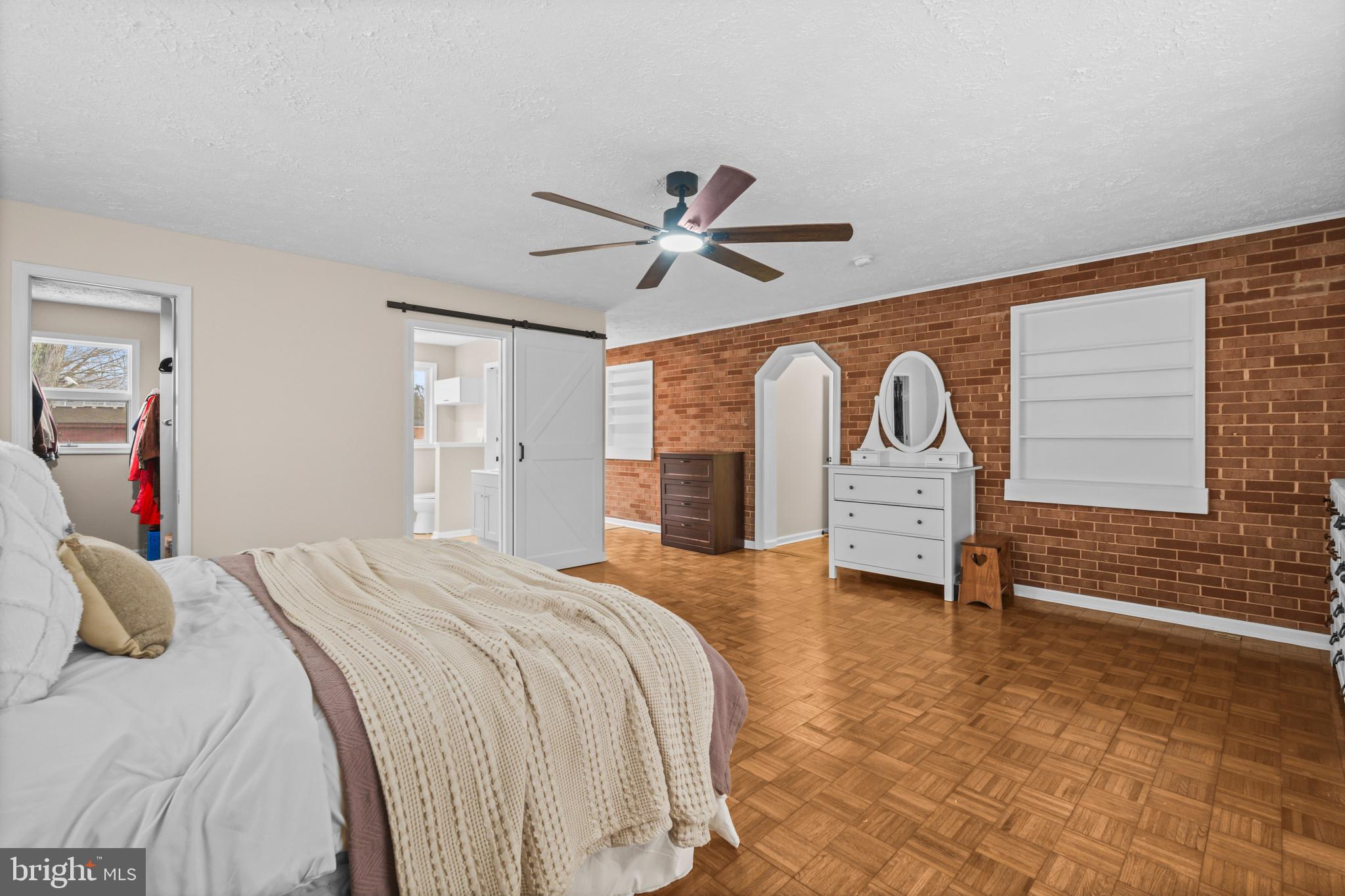 10514 Willetts Crossing Road White Plains, MD 20695 - Photo 14 of 41 a bedroom with a bed and a chandelier