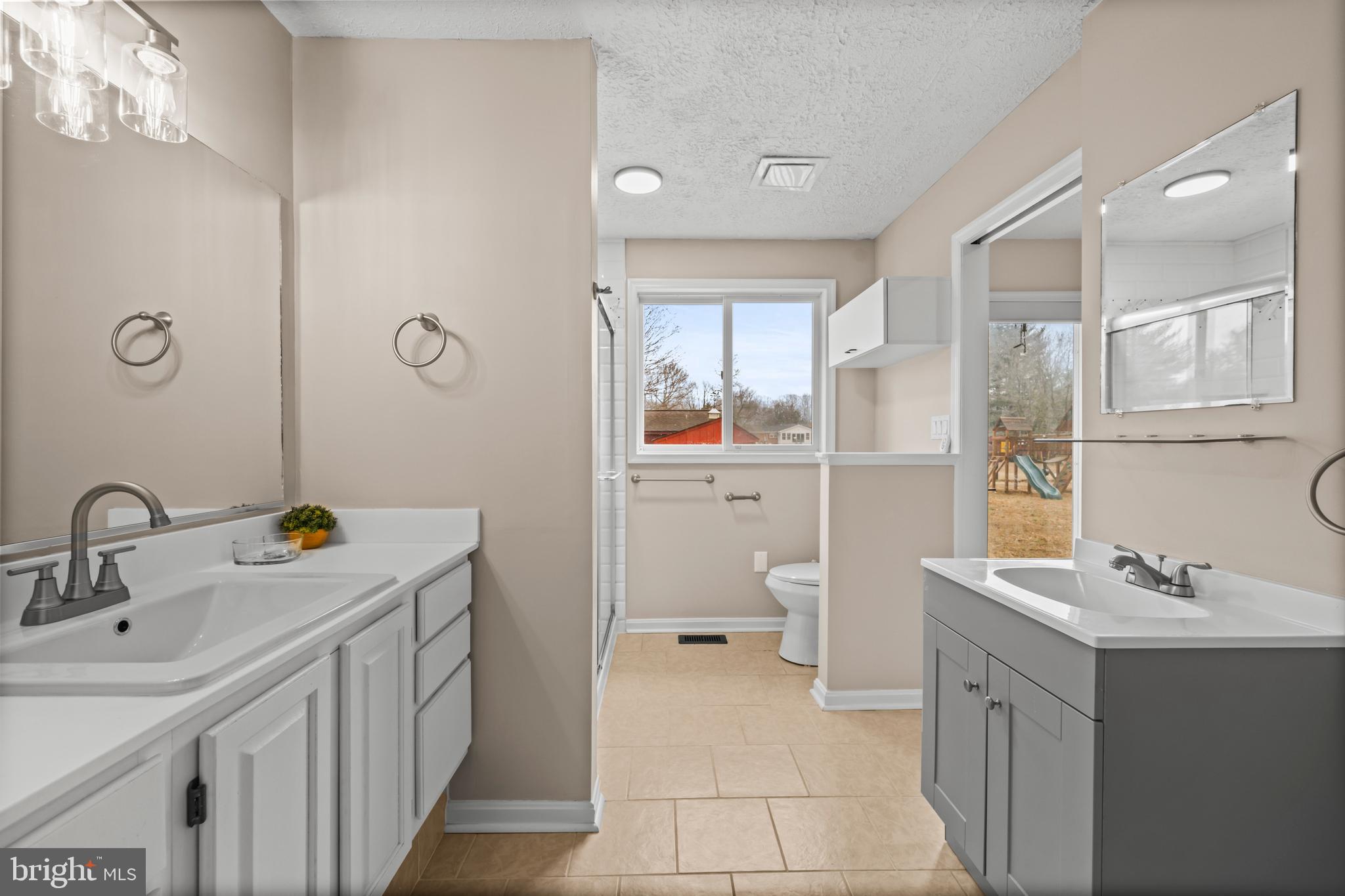 10514 Willetts Crossing Road White Plains, MD 20695 - Photo 15 of 41 a bathroom with a sink a toilet and shower