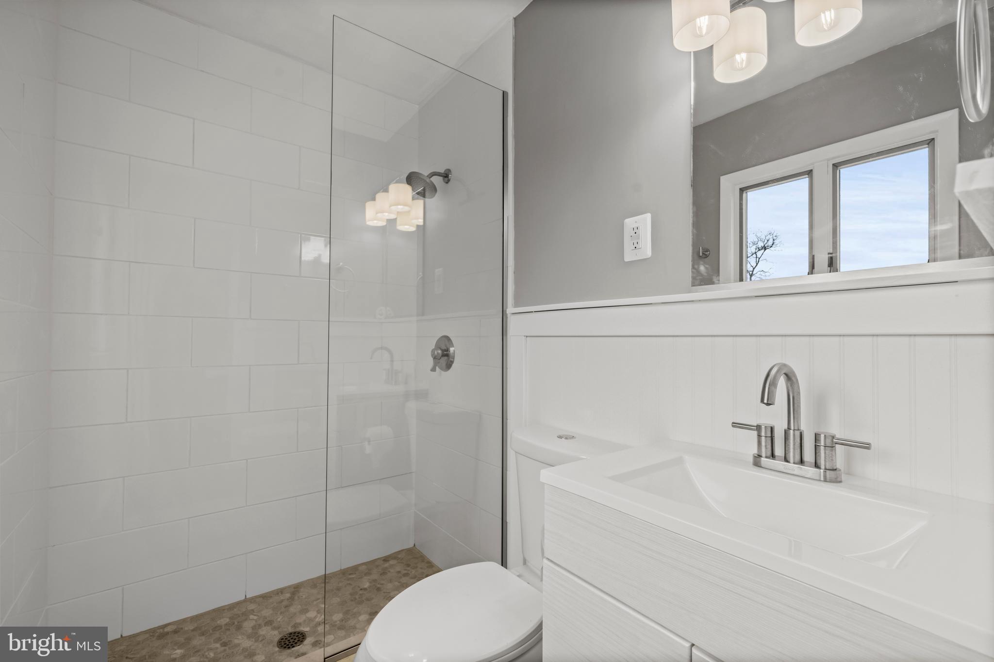 10514 Willetts Crossing Road White Plains, MD 20695 - Photo 16 of 41 a bathroom with a sink and a mirror