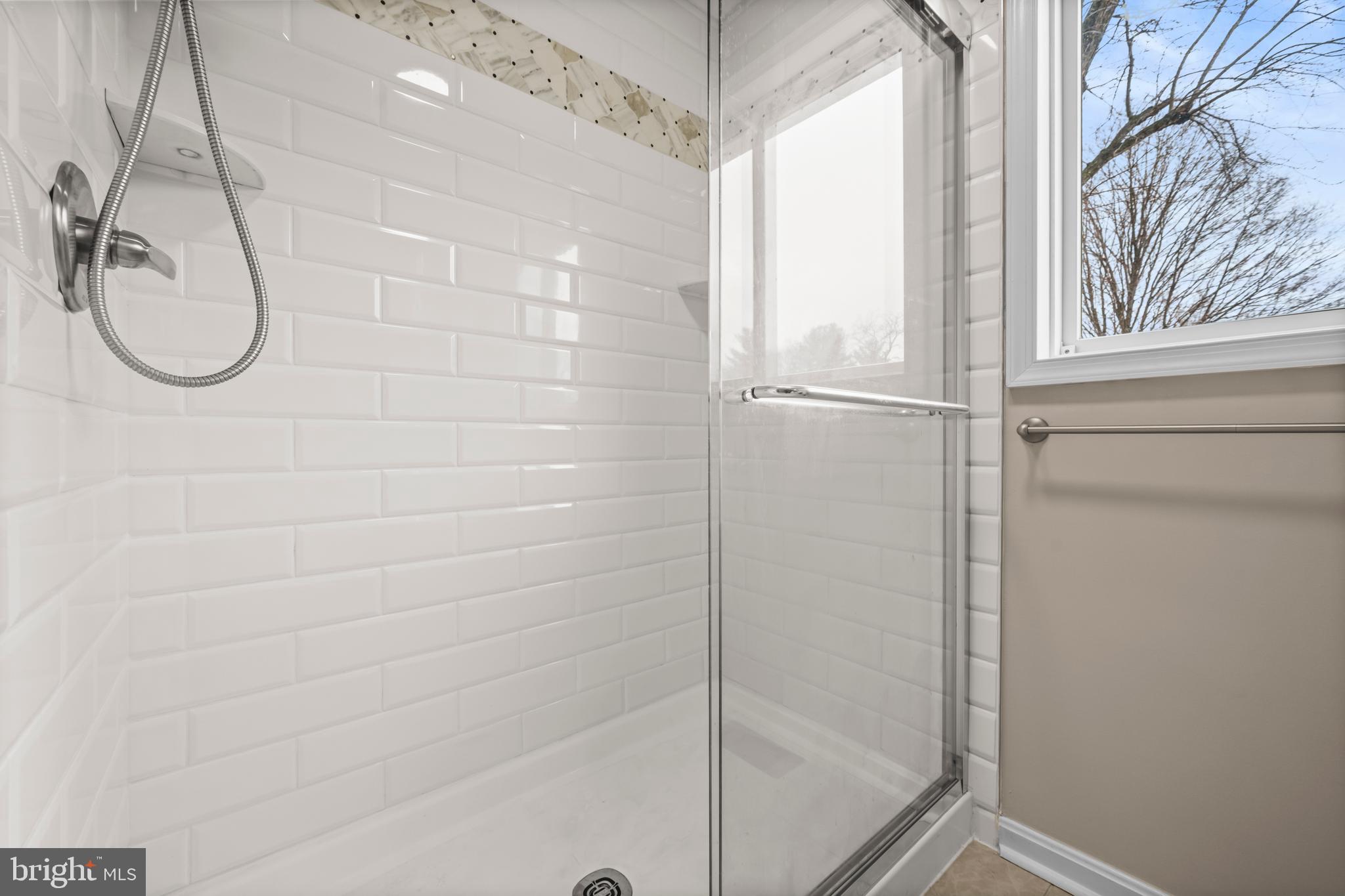 10514 Willetts Crossing Road White Plains, MD 20695 - Photo 19 of 41 a bathroom with a glass shower door