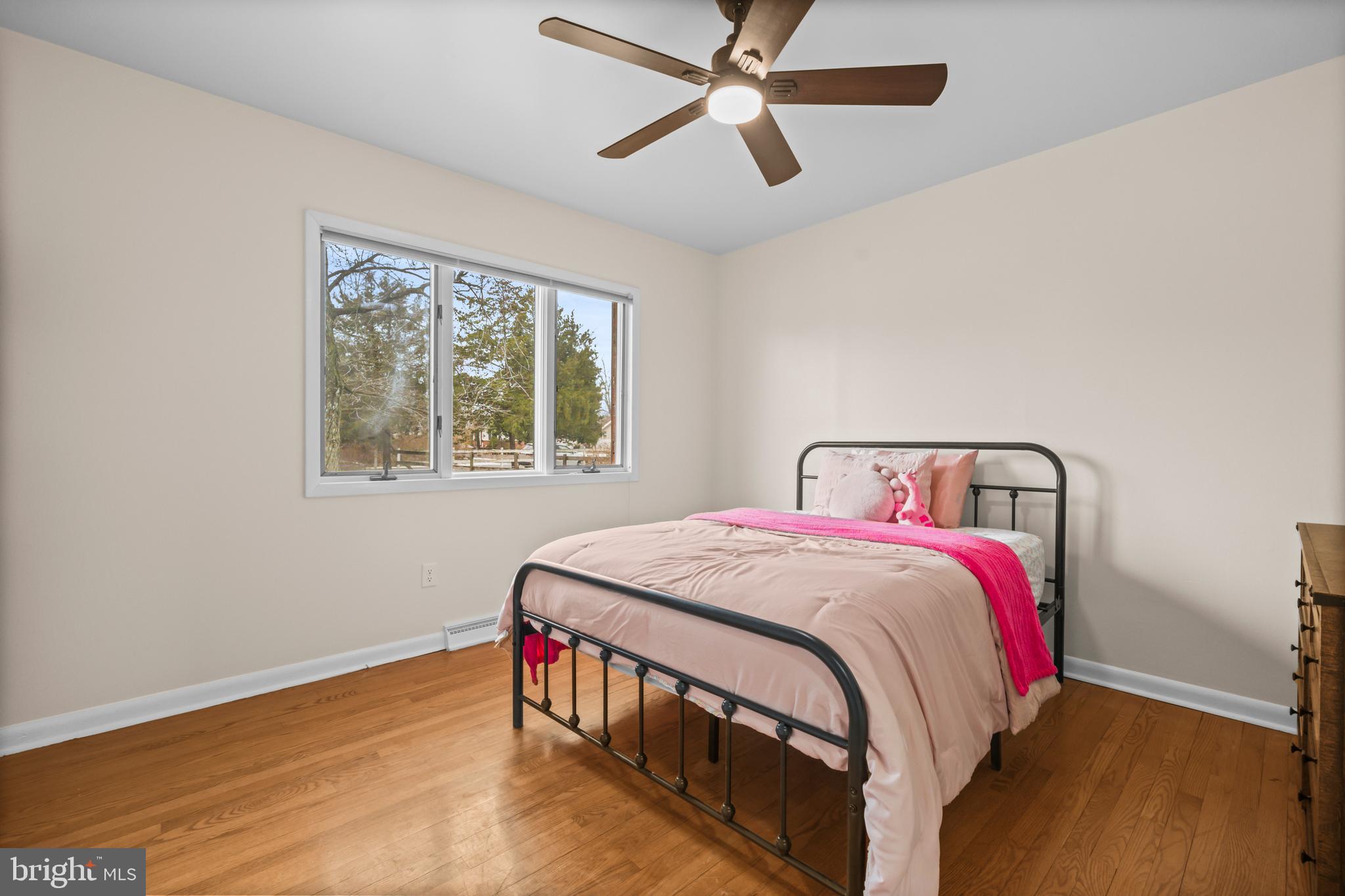 10514 Willetts Crossing Road White Plains, MD 20695 - Photo 21 of 41 a bedroom with a bed and wooden floor