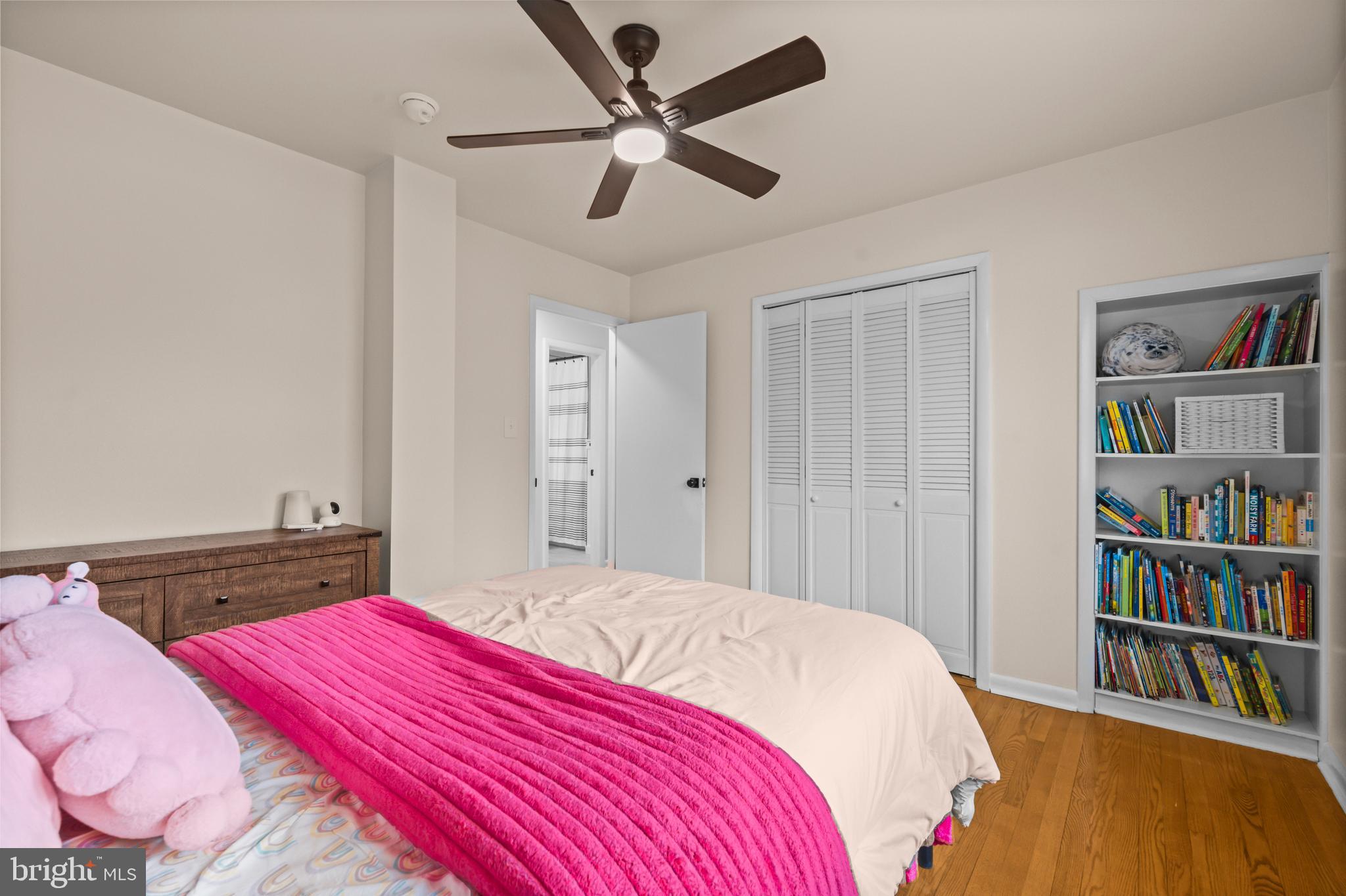 10514 Willetts Crossing Road White Plains, MD 20695 - Photo 22 of 41 a bedroom with a bed and a book shelf