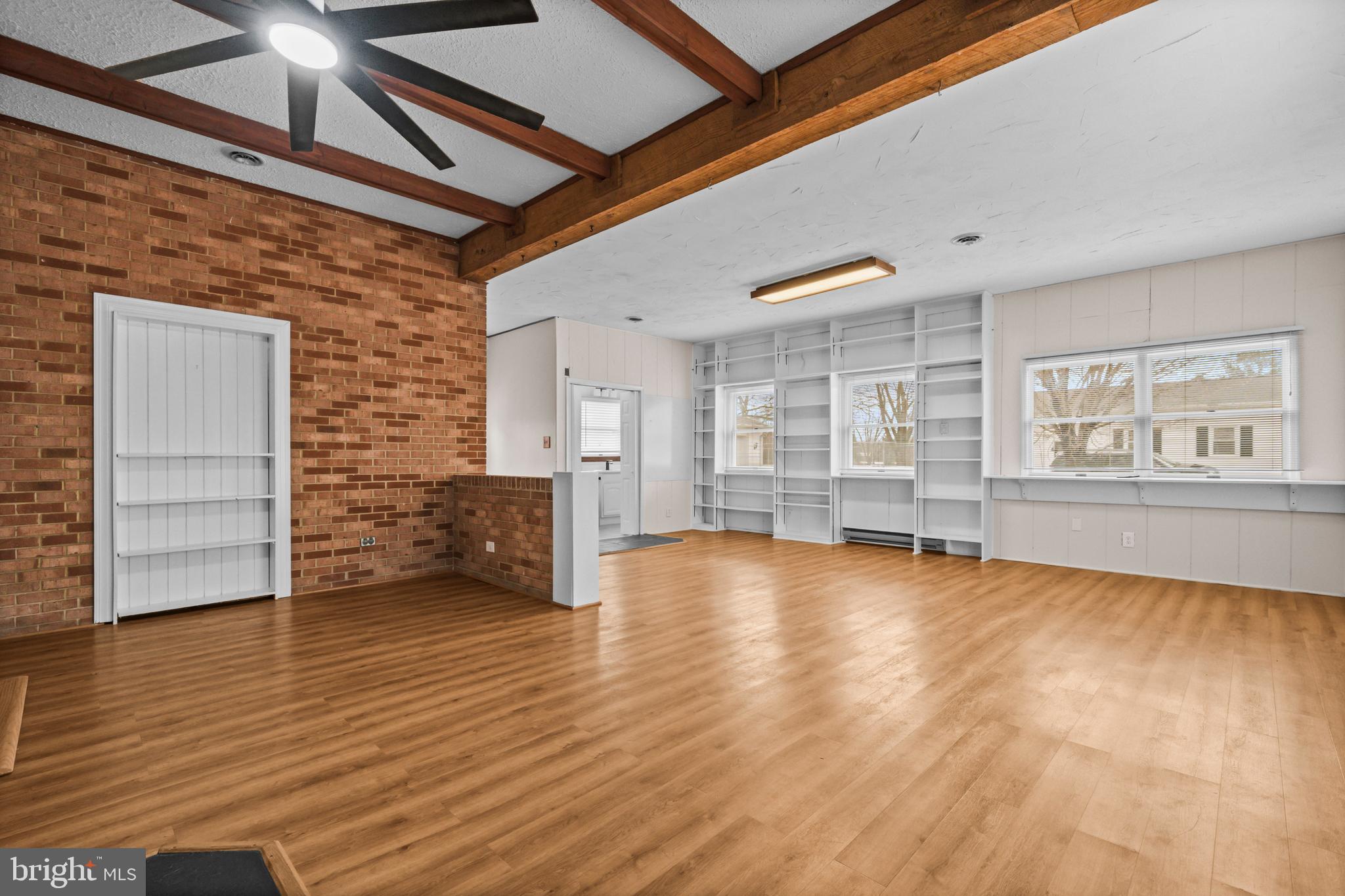 10514 Willetts Crossing Road White Plains, MD 20695 - Photo 27 of 41 a view of an empty room with a window and wooden floor