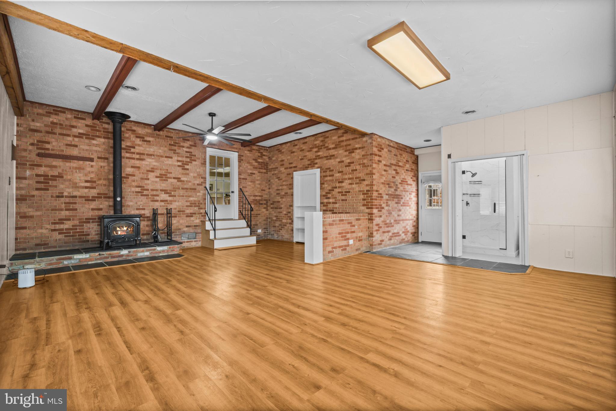 10514 Willetts Crossing Road White Plains, MD 20695 - Photo 28 of 41 a view of empty room with wooden floor and fan