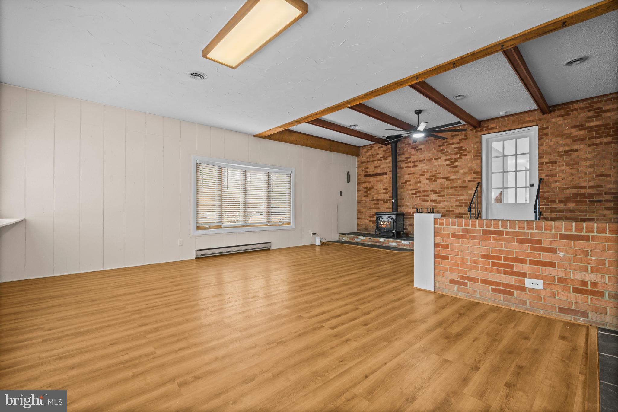 10514 Willetts Crossing Road White Plains, MD 20695 - Photo 29 of 41 a view of empty room with wooden floor and fan