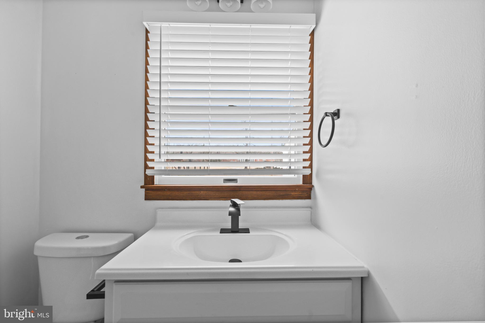 10514 Willetts Crossing Road White Plains, MD 20695 - Photo 31 of 41 a bathroom with a sink and a window