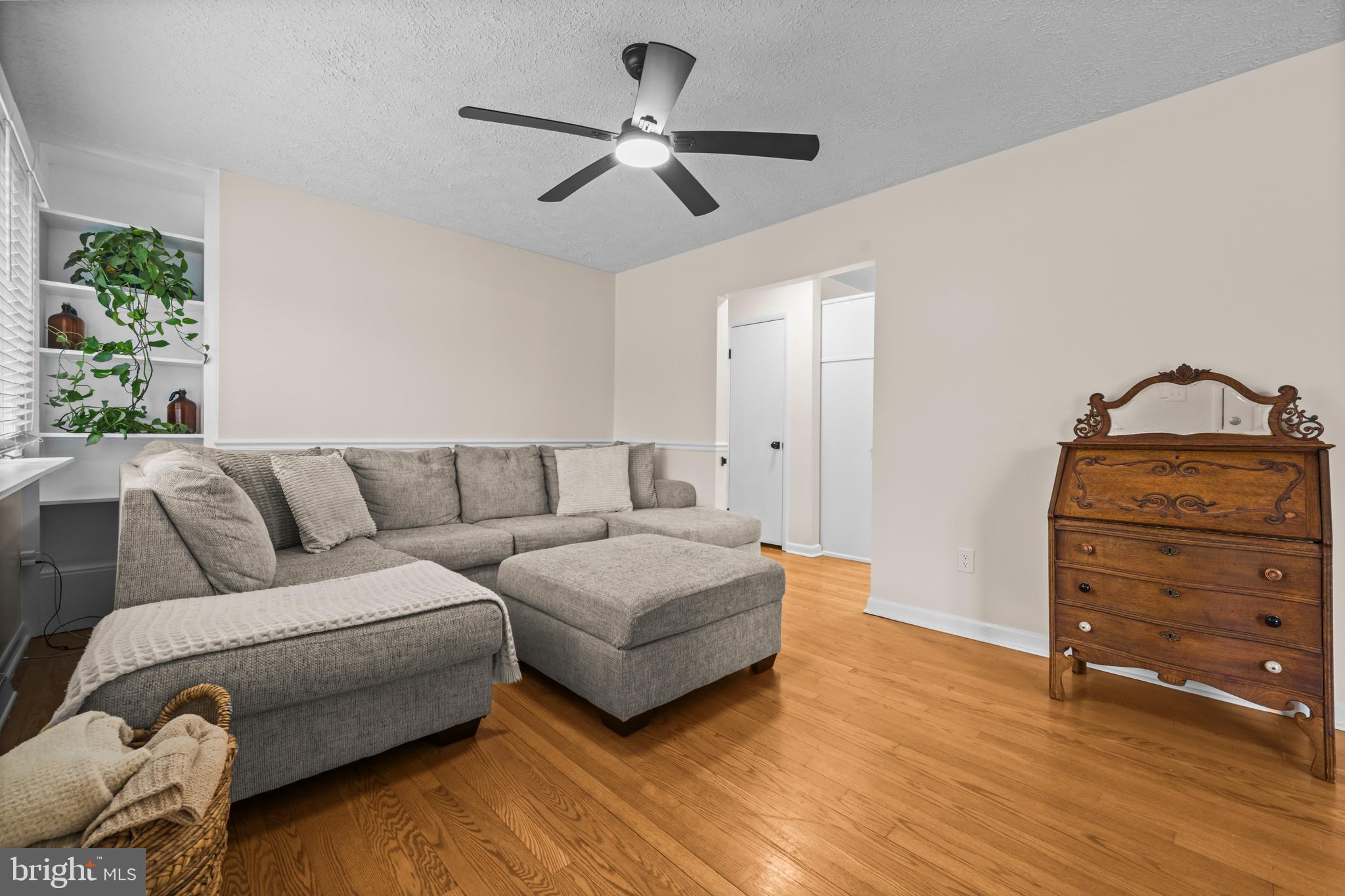 10514 Willetts Crossing Road White Plains, MD 20695 - Photo 4 of 41 a living room with furniture and a ceiling fan
