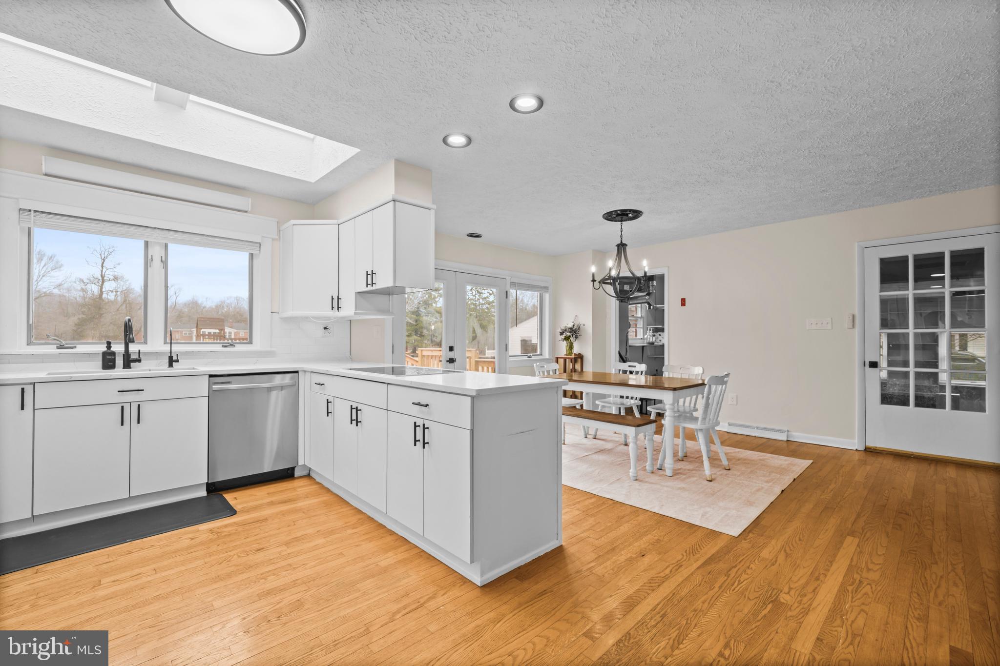 10514 Willetts Crossing Road White Plains, MD 20695 - Photo 9 of 41 a kitchen with a sink cabinets and wooden floor