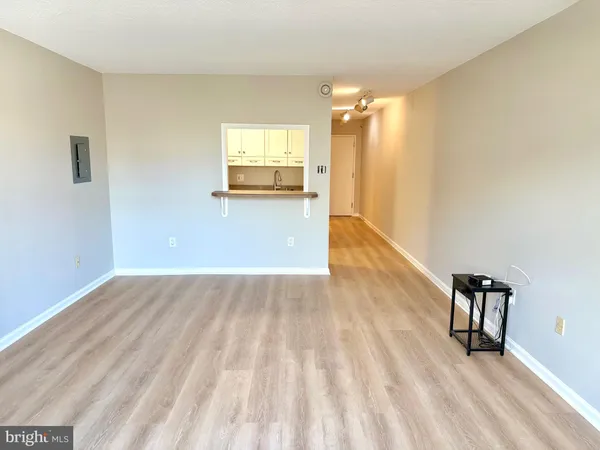 a view of a livingroom with wooden floor