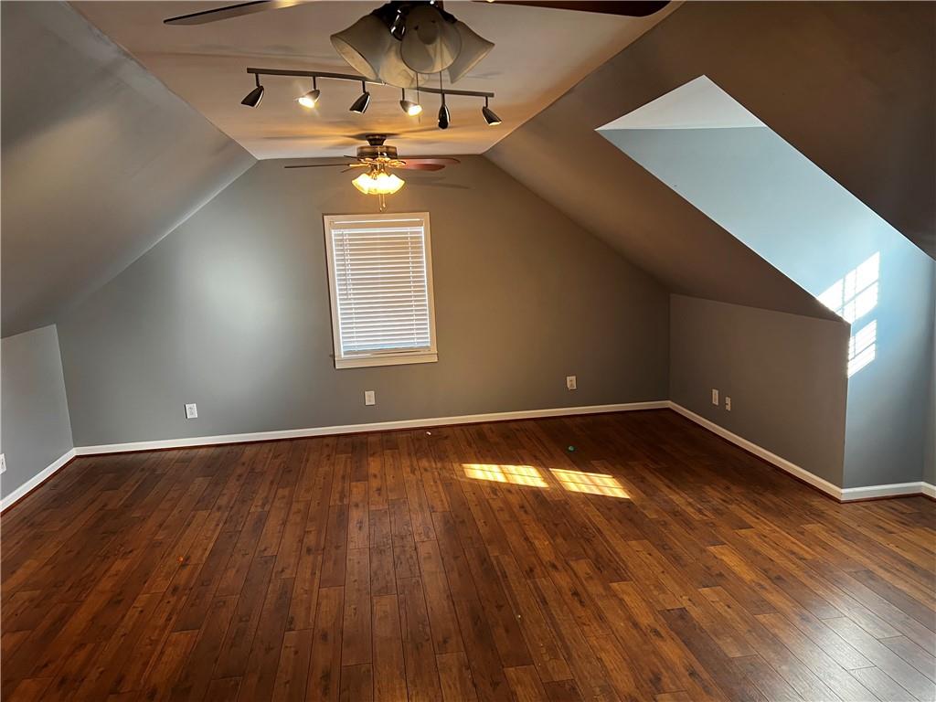 606 Pisgah Way Calhoun, GA 30701 - Photo 17 of 18 a view of an empty room with wooden floor and a window