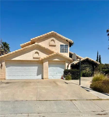 a front view of a house with a garage