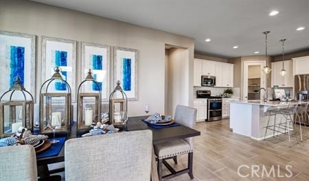 677 Evening Cloud Street Hemet, CA 92543 - Photo 5 of 7 a living room with furniture kitchen view and large windows