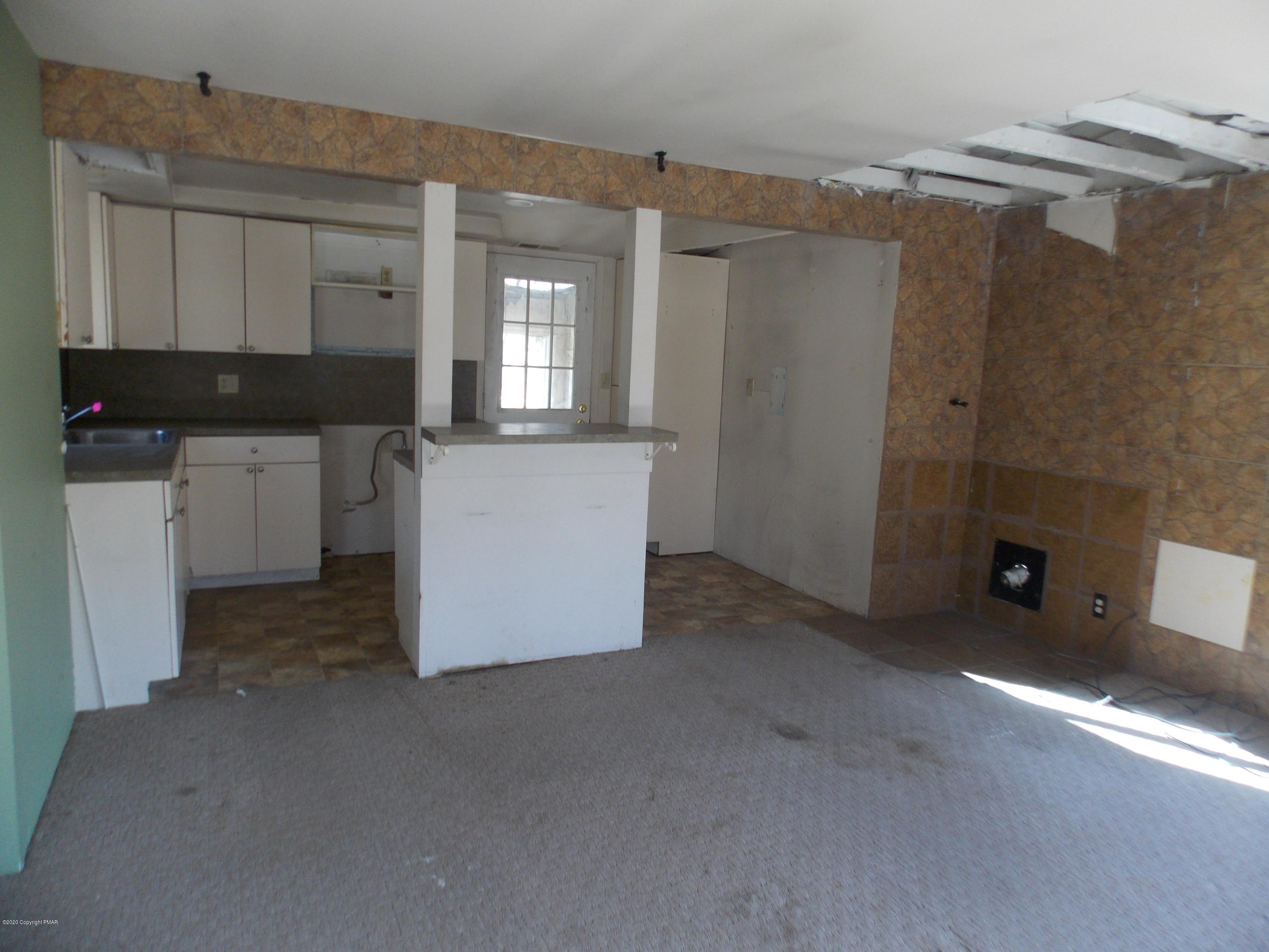 1619 Donalds Road Effort, PA 18330 - Photo 2 of 6 a kitchen with a refrigerator and a stove