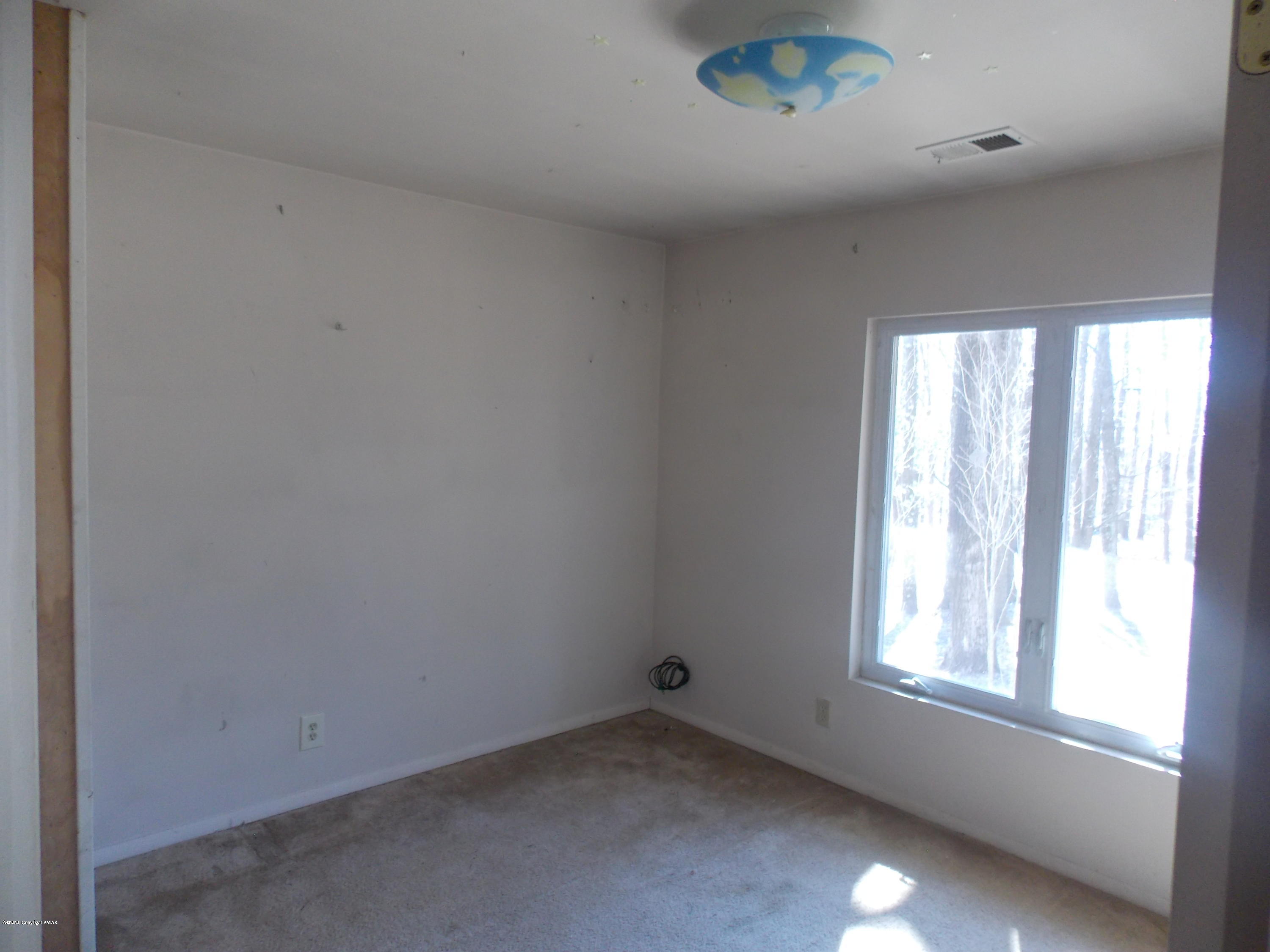 1619 Donalds Road Effort, PA 18330 - Photo 3 of 6 an empty room with a window