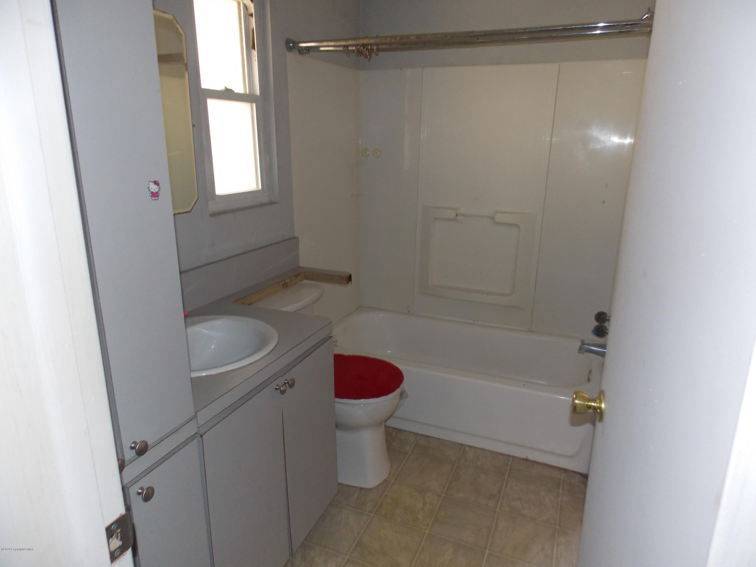 1619 Donalds Road Effort, PA 18330 - Photo 6 of 6 a bathroom with a sink a toilet and shower