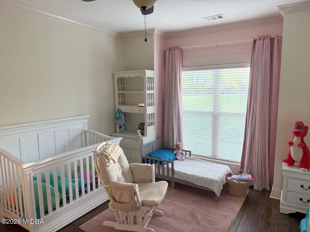 917 Broken Arrow Trail Perry, GA 31069 - Photo 29 of 34 a bedroom with furniture and a window