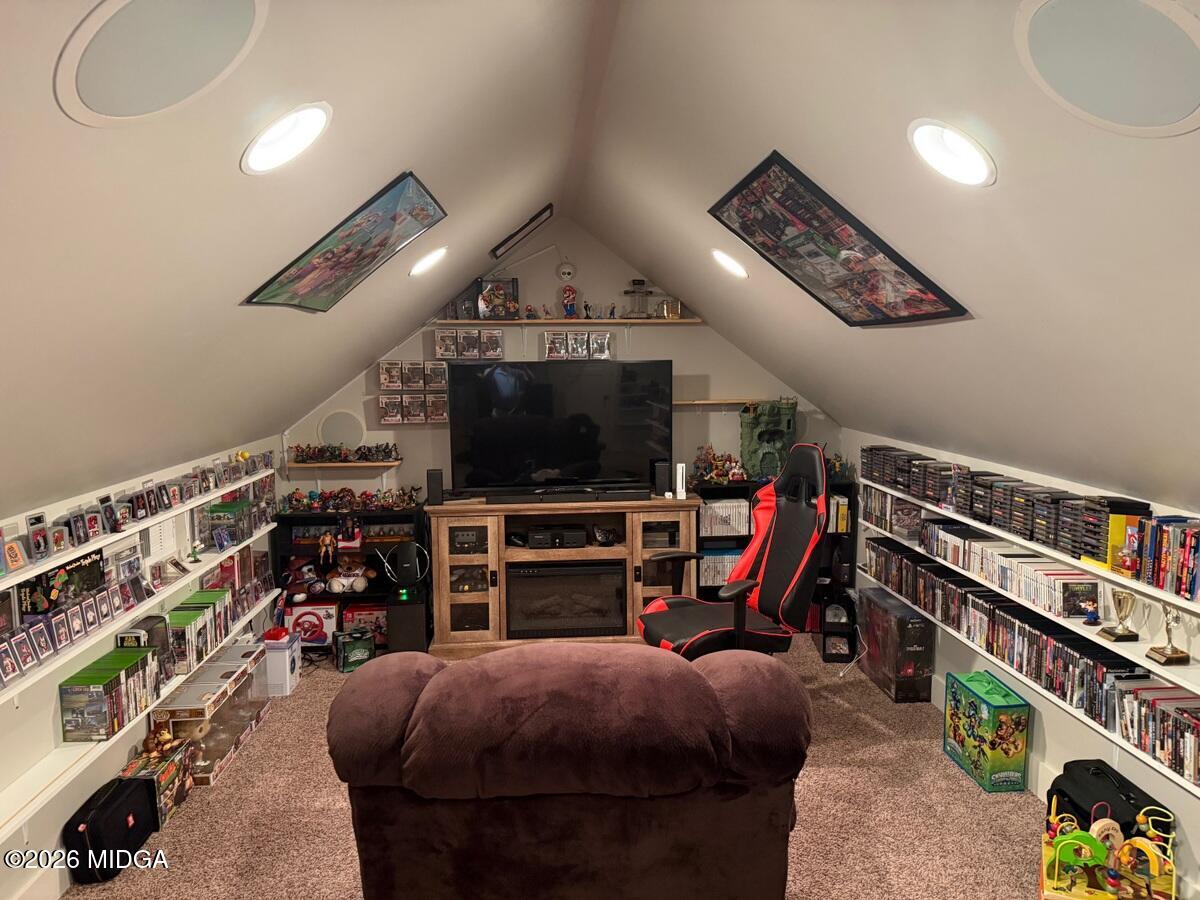 917 Broken Arrow Trail Perry, GA 31069 - Photo 33 of 34 a bedroom with furniture and a flat screen tv