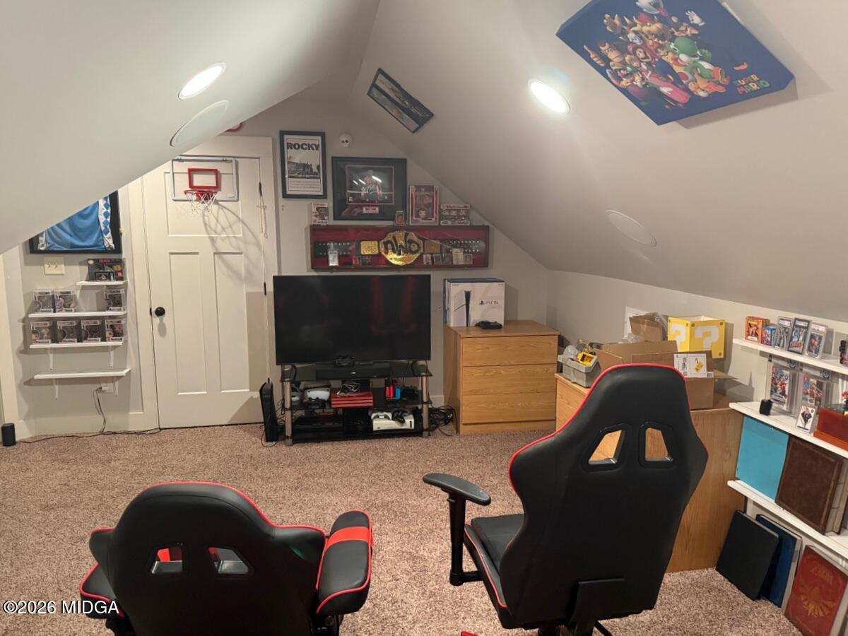 917 Broken Arrow Trail Perry, GA 31069 - Photo 34 of 34 a living room with furniture and a flat screen tv