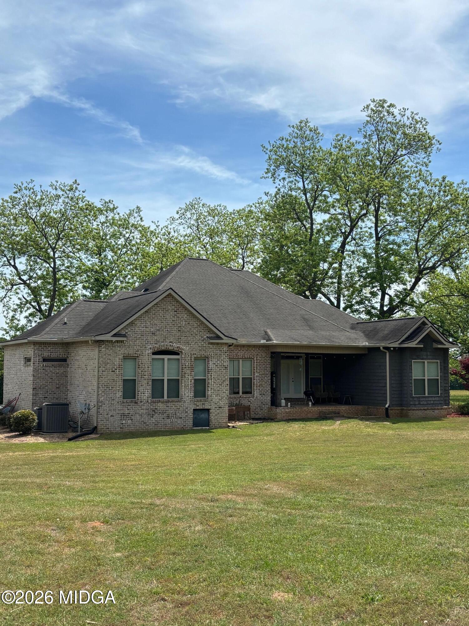 917 Broken Arrow Trail Perry, GA 31069 - Photo 7 of 34 a front view of a house with a garden
