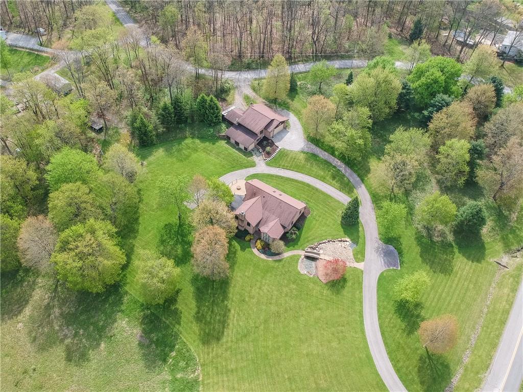481 Chicora Fenelton Road Chicora, PA 16025 - Photo 2 of 50 Aerial exterior image highlighting the home’s expansive setting, mature landscaping, and outdoor entertaining areas.
