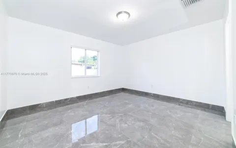 a bathroom with a toilet sink and shower