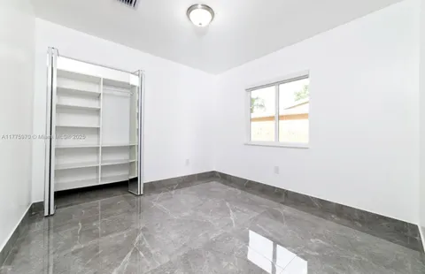a bathroom with a toilet sink and shower