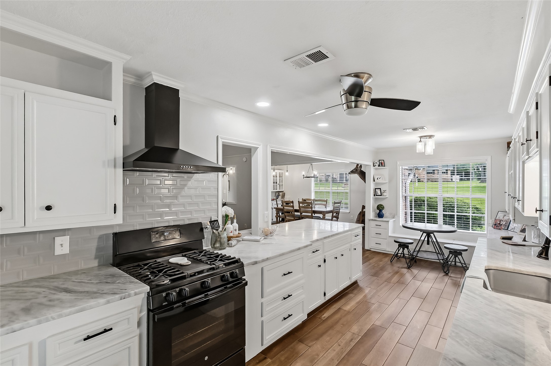 906 Standley Road Madisonville, TX 77864 - Photo 19 of 40 a kitchen with stainless steel appliances a stove sink and cabinets