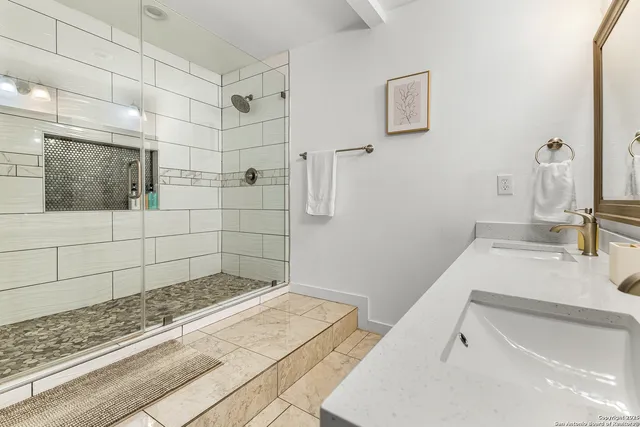 a bathroom with a sink and mirror