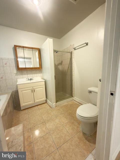 7135 Oak Ridge Road Falls Church, VA 22042 - Photo 25 of 41 a bathroom with a sink toilet and shower