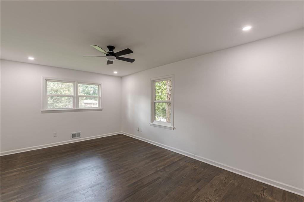 2352 Glendale Drive Decatur, GA 30032 - Photo 20 of 39 an empty room with wooden floor and ceiling fan