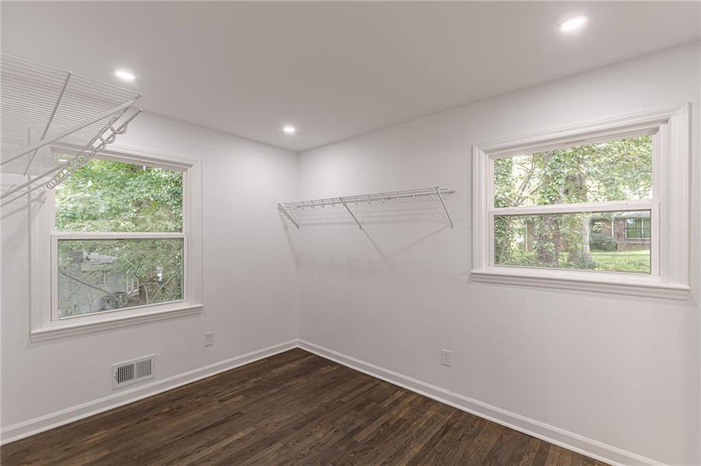 2352 Glendale Drive Decatur, GA 30032 - Photo 24 of 39 an empty room with wooden floor and windows