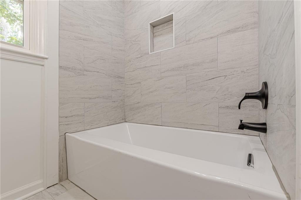 2352 Glendale Drive Decatur, GA 30032 - Photo 27 of 39 a white bath tub and a shower