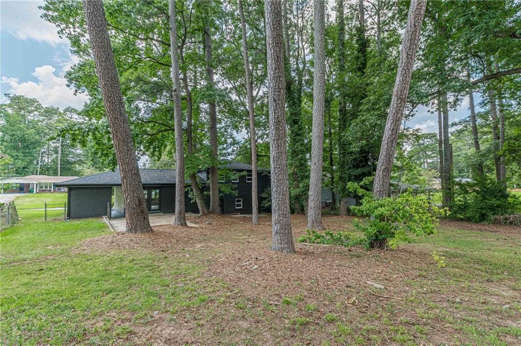 2352 Glendale Drive Decatur, GA 30032 - Photo 4 of 39 a view of a backyard with a garden and trees