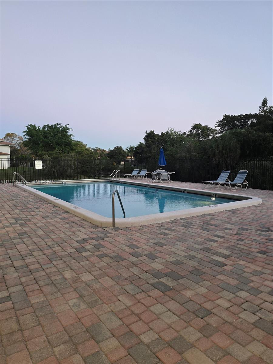 9050 Northwest 28th Street, Unit 110 Coral Springs, FL 33065 - Photo 11 of 13 a view of lake view and mountain view