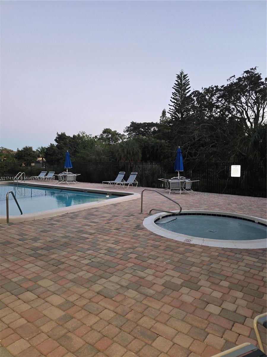 9050 Northwest 28th Street, Unit 110 Coral Springs, FL 33065 - Photo 12 of 13 a view of outdoor space with lake view