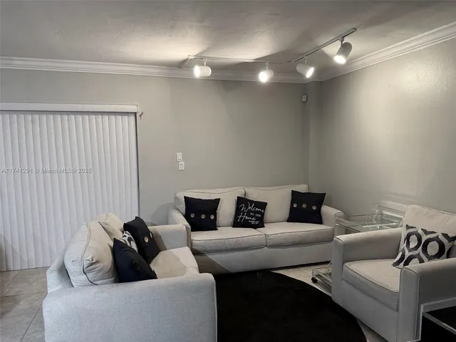 a living room with furniture and a couch