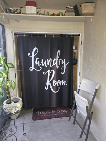 a front view of a fireplace with table and couch