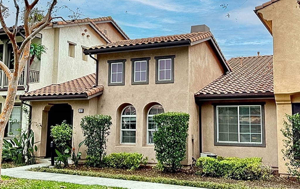 a front view of a house with garden
