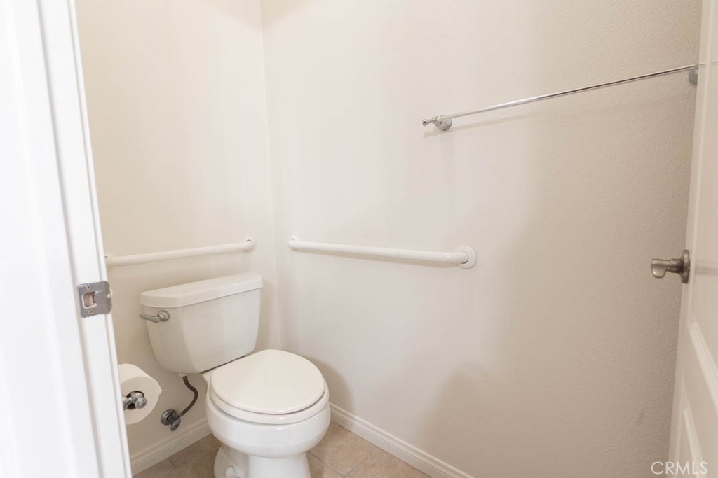 40 Tea Garden Irvine, CA 92620 - Photo 17 of 27 a white toilet sitting next to a small sink