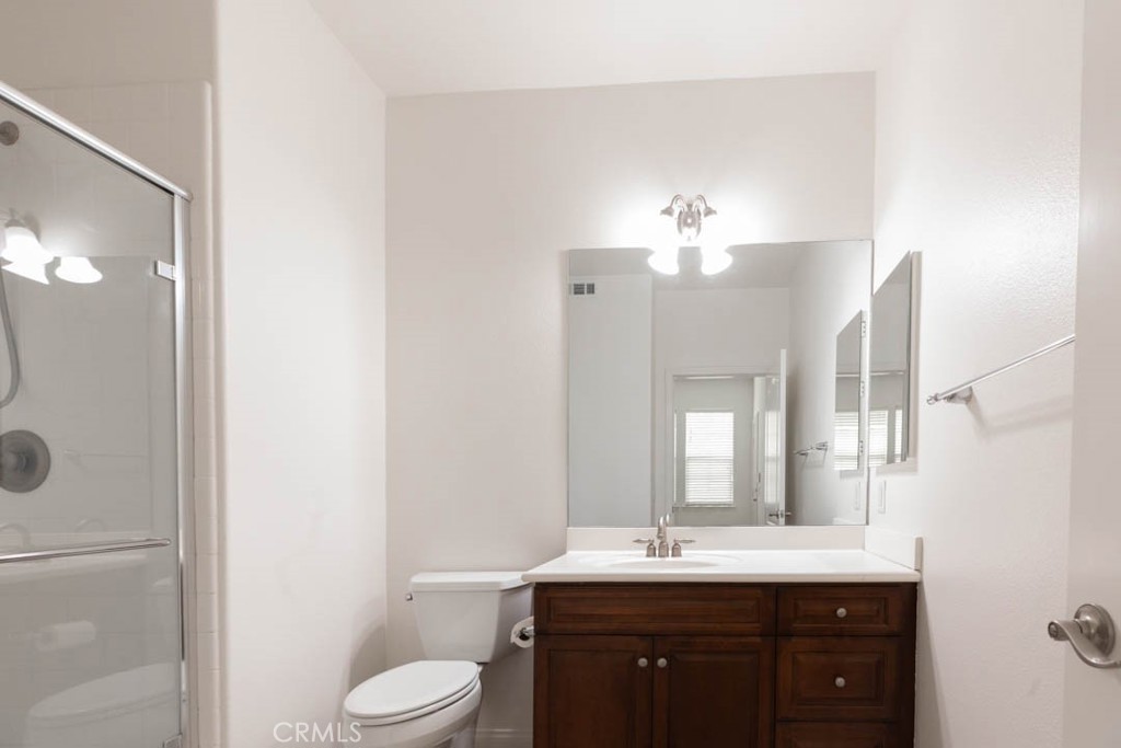 40 Tea Garden Irvine, CA 92620 - Photo 24 of 27 a bathroom with a sink vanity granite and toilet