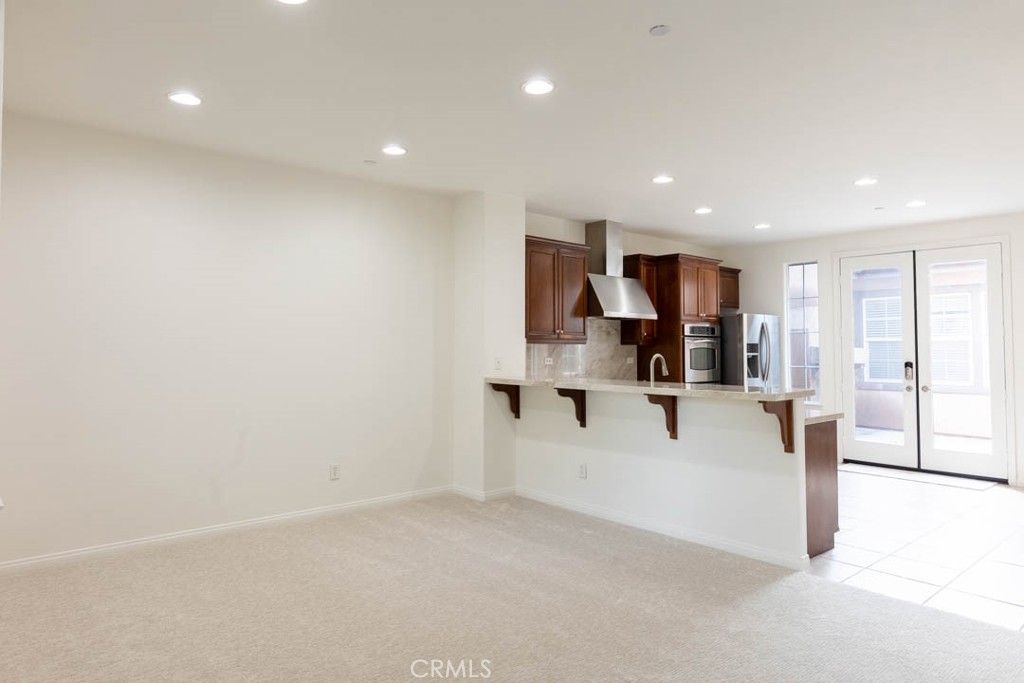 40 Tea Garden Irvine, CA 92620 - Photo 3 of 27 a view of kitchen with refrigerator sink and cabinets