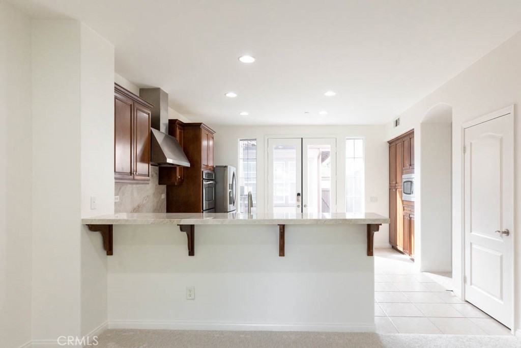 40 Tea Garden Irvine, CA 92620 - Photo 4 of 27 a view of living room with furniture and a flat screen tv