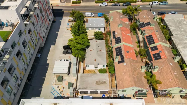 an aerial view of residential houses with outdoor space
